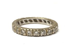 A 18ct gold Eternity ring set with Moissanite ston