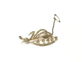 A 9ct gold seed pearl brooch. 3.94g and 5cm wide.