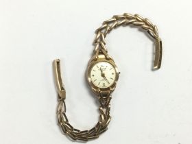 A 9ct gold Accurist ladies watch. Shipping categor