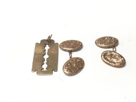 A pair of 9ct cufflinks and a 9ct gold pendant. To