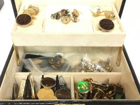A jewellery box containing cufflinks, tie pins etc