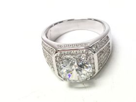 A large silver gents dress ring set with white CZ.