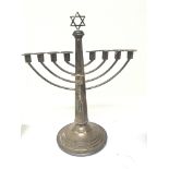 A Silver Menorah with nine candle holders loaded b