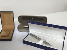 A boxed Dupont lighter seen working a boxed Waterm