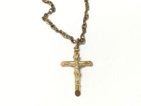 A 9ct gold cross pendant on chain. Total weight 11