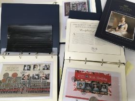Three albums of Commemorative stamp and coin cover