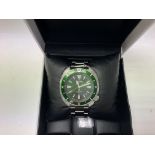 A boxed seiko tortoise divers watch with green dia