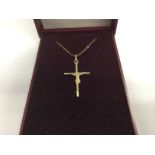 A 9ct gold Elizabeth Duke cross and chain in a fit