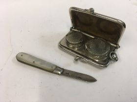 A silver sovereign case and a mother of pearl and silver fruit knife. Approx weight 47.14 grams .
