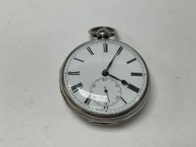 A silver cased key wind pocket watch, seen working