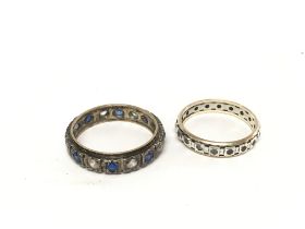 Two eternity rings set with coloured stones. NO RE