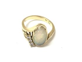 An 18ct gold Opal and diamond set ring. Size N and