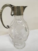 A Victorian cut claret jug with silver collar and