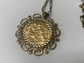 A gold sovereign fitted in mount with attached 9ct chain total weight 15.9 grams.