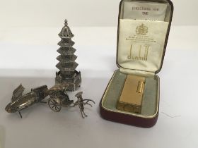 A cased Dunhill lighter a Chinese Silver Pagoda wi