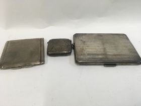 A vesta case and a silver cigarette case and a silver compact. Approx 314.1 grams.