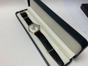 A 9ct gold Garrard men‰Ûªs dress watch with presen