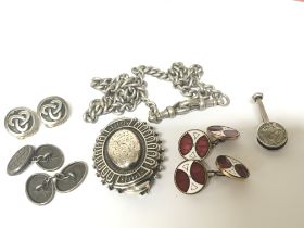 A collection of silver jewellery cufflinks a watch