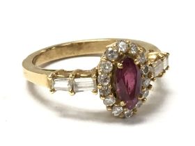 A 18ct gold ring set with Ruby and diamonds. size