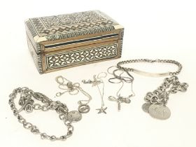 A small collection of silver necklaces and bracele