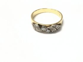 An 18ct yellow and white gold ring. Size n 1/2 and