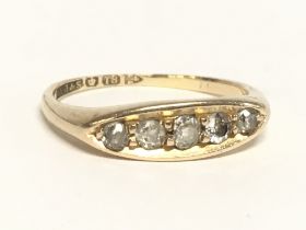 An 18ct gold five stone diamond old cut ring, Size