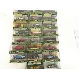 A collection of 23 boxed model cars by Corgi in th