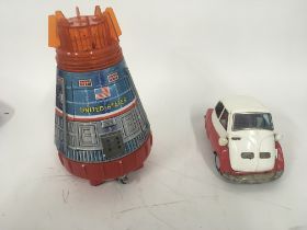 A pair of tinplate toys one Space Capsule battery
