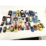A collection of 33 Playworn model cars of varying