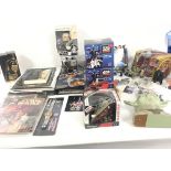 A collection of modern Star Wars toys..books..figu