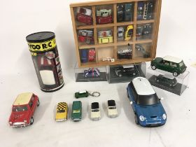 A collection of models of mini cars by a variety o