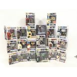 A collection of 20 boxed funko pop figures.