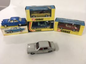 A collection of diecast model cars by Corgi and Di