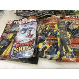 A collection of transformers comics in excess of 30 issues mainly still unopened and with free toy