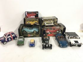 A collection of 11 model cars in varying scales 5