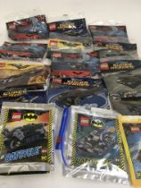 A collection of 15 bagged Lego pieces all relating to Batman.