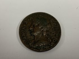 A 1675 Charles II copper farthing. (A)
