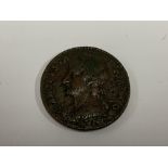 A 1675 Charles II copper farthing. (A)