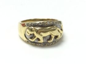 An 18ct gold Jaguar ring, inset with small diamond