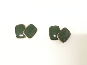 A pair of 9ct gold cufflinks set with green stone.