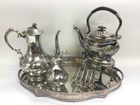 A collection of silver plated items including a se