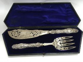 A silver fish serving set.