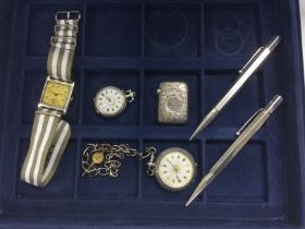 A coin case of silver items including watches, pro