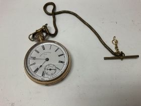 A gold plated pocket watch.