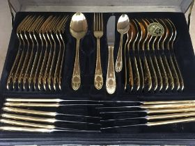 A cased gilt Solingen cutlery set .