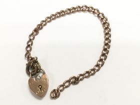 9ct yellow gold curb bracelet with a padlock clasp