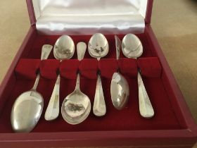 A cased set of silver spoons and a three piece sil
