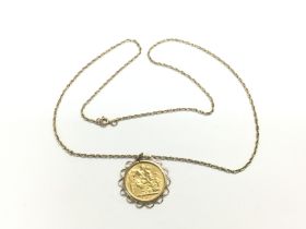 A 1900 gold sovereign suspended on a 9ct gold chai