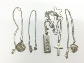 A silver ingot pendant, cross and other mainly sil