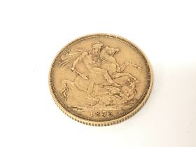 An 1876 full sovereign. Postage A